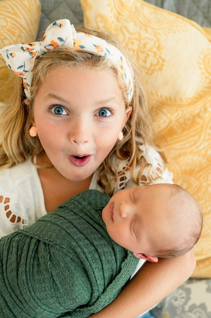 A photo depicts colorful newborn photography in Houston TX  