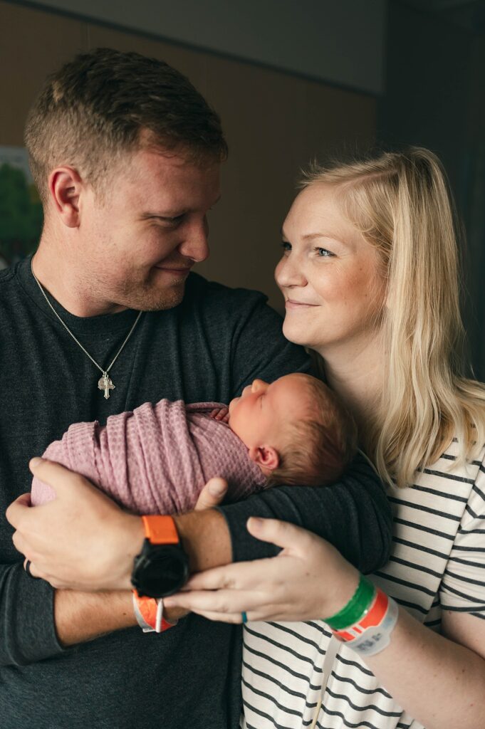 Parents cradle their newborn daughter during a Fresh 48 at a Houston hospital
