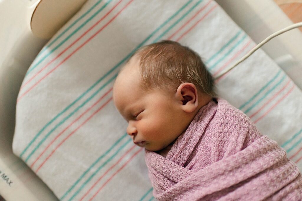 A newborn baby girl is photographed at a Houston hospital during a Fresh 48 session