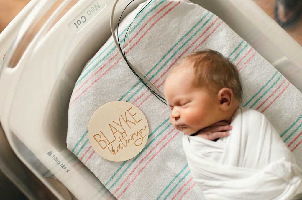 A newborn is photographed at a Houston hospital NICU for a fresh 48 session with Houston TX newborn photographer 