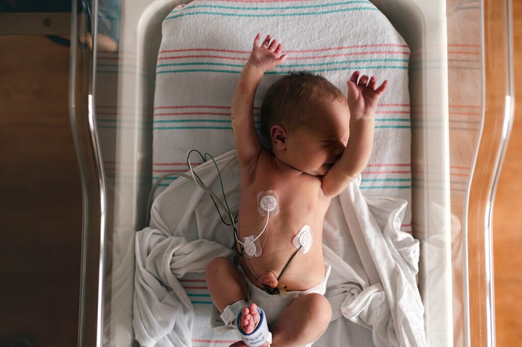 A Houston TX newborn is photographed during a fresh 48 session at Memorial Hermann Memorial City Medical Center