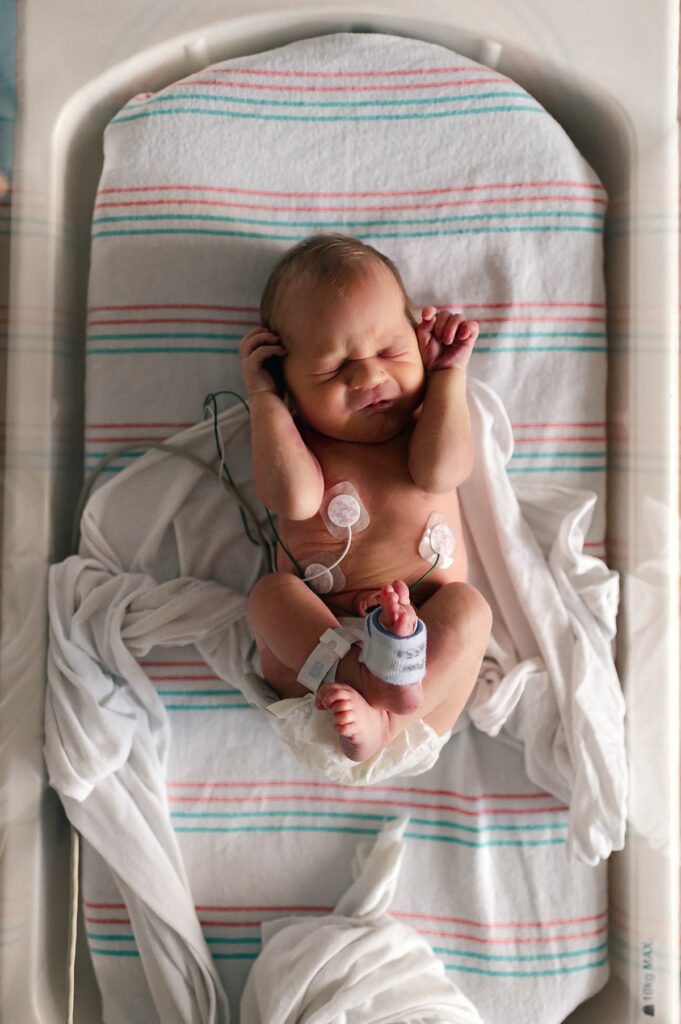 A Fresh 48 newborn photoshoot is taken at a Houston Hospital