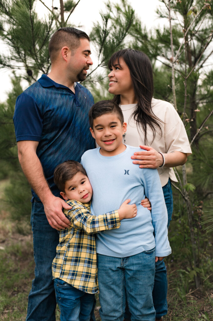 A Texas family of four poses for their outdoor family photos