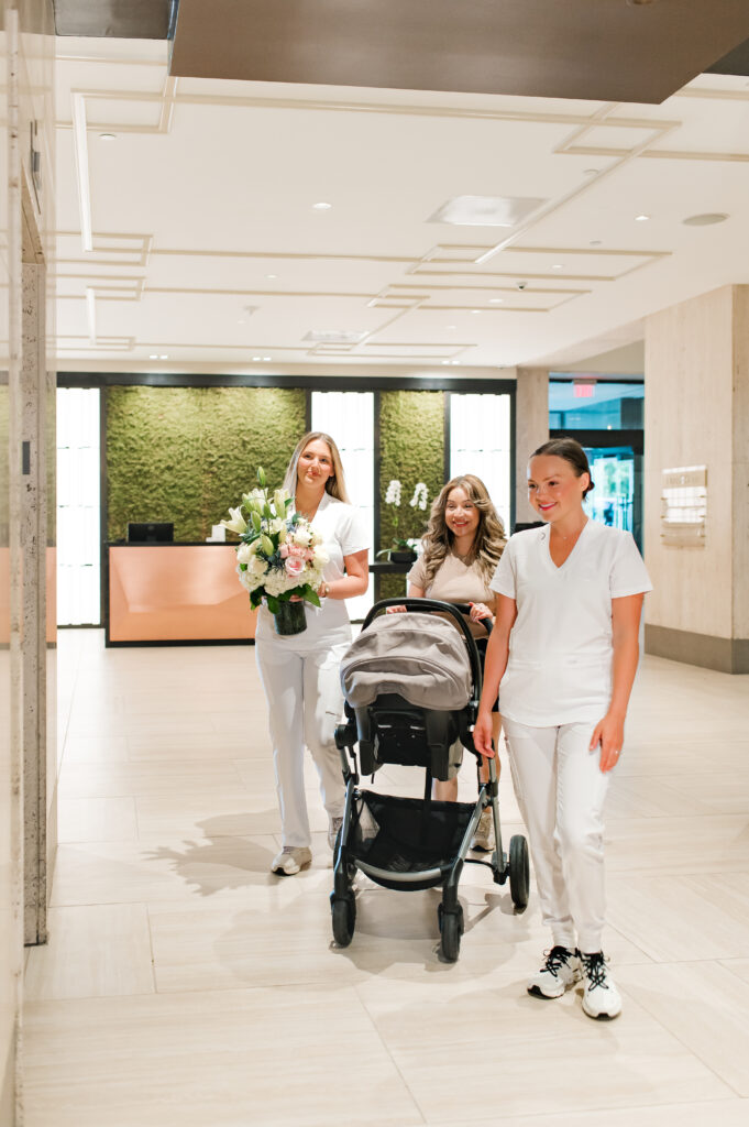 The Ruby Postnatal nursery staff help a mother and her newborn to her suite