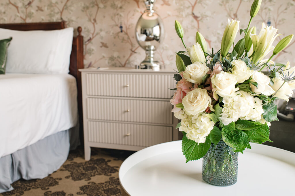 Fresh florals are photographed on the table of The Ruby Postnatal, located in The Omni Hotel in Houston, TX