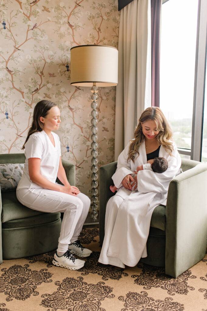 A new mother nurses her newborn child from her seat inside the luxury postnatal suite at The Omni Hotel