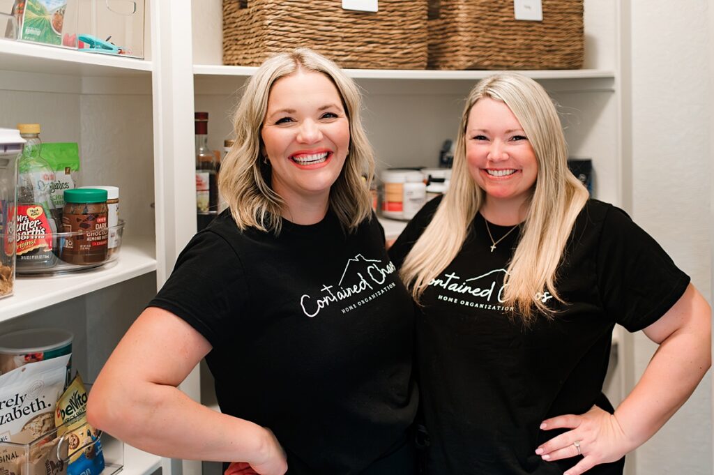 Contained Chaos, professional organizers houston tx, are pictured on site at a pantry organization project 