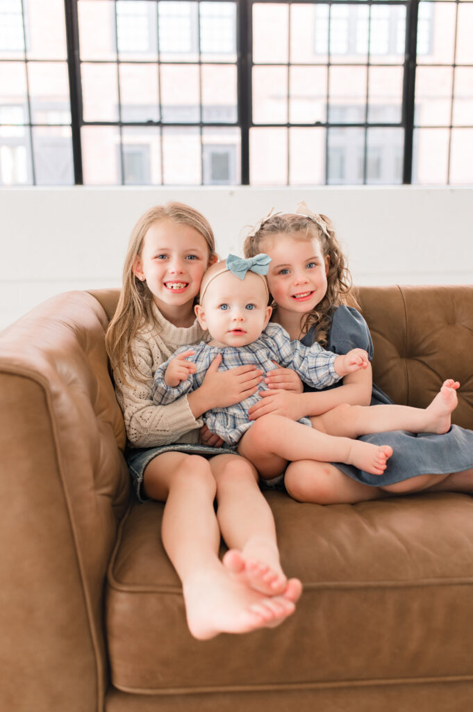 Three young girls are photographed in a natural light studio during a Houston photo session with family photographer, Mel B Photo 