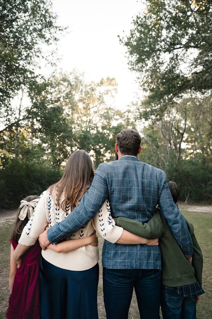 A family of four is pictured during family portraits houston tx