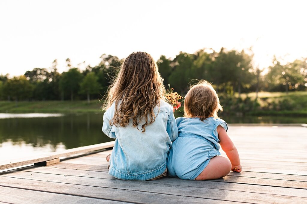 Two young girls are photographed during family photos Houston TX