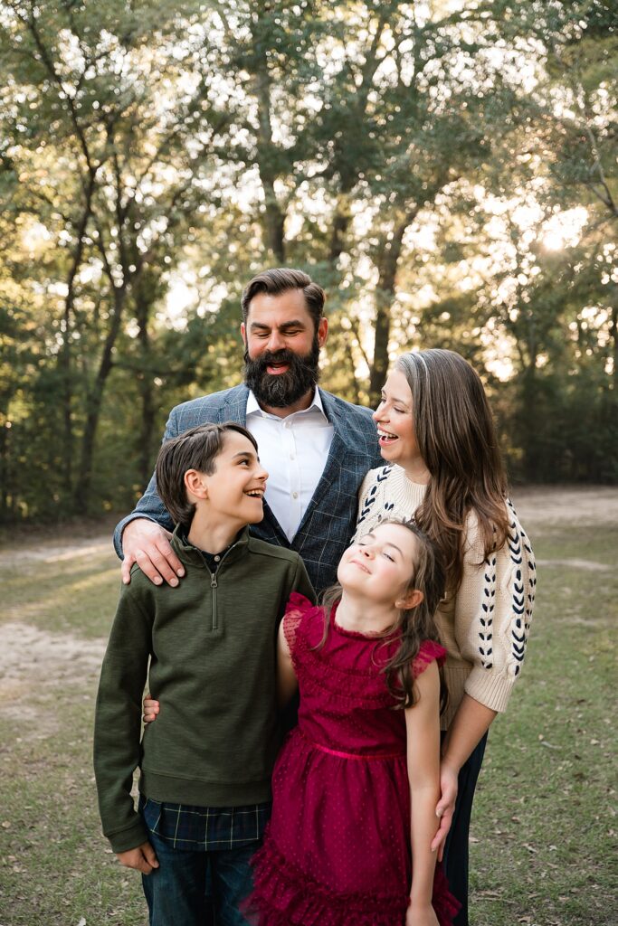 A family of 4 is photographed during family portraits houston tx