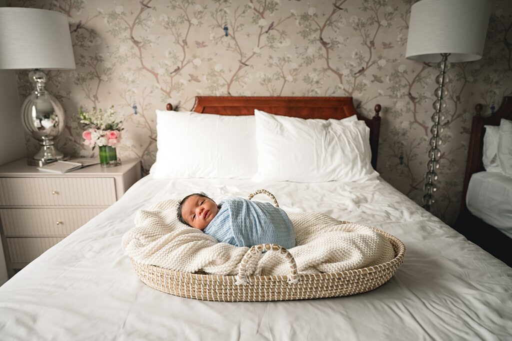 a newborn baby boy is pictured in a photo taken by newborn photographers in the woodlands tx