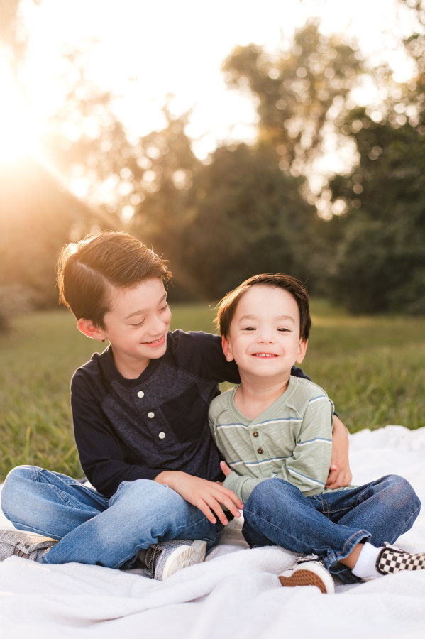 A photo taken in a park in the Bridgeland Community in Cypress, TX showcases two young brothers