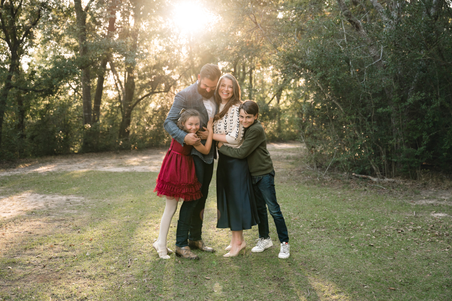 A golden hour family portrait taken at a city park houston texas. 