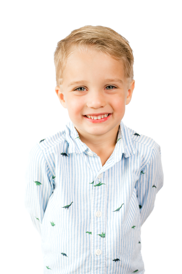 A modern school photo taken by a Houston school photographer shows a young boy smiling.