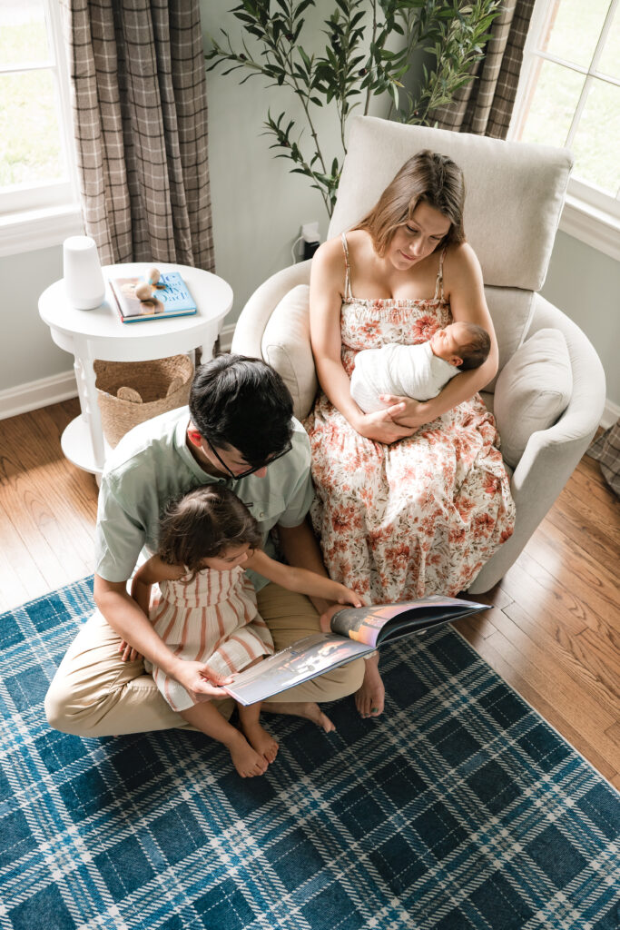A family of four is photographed during a houston newborn photography session. 