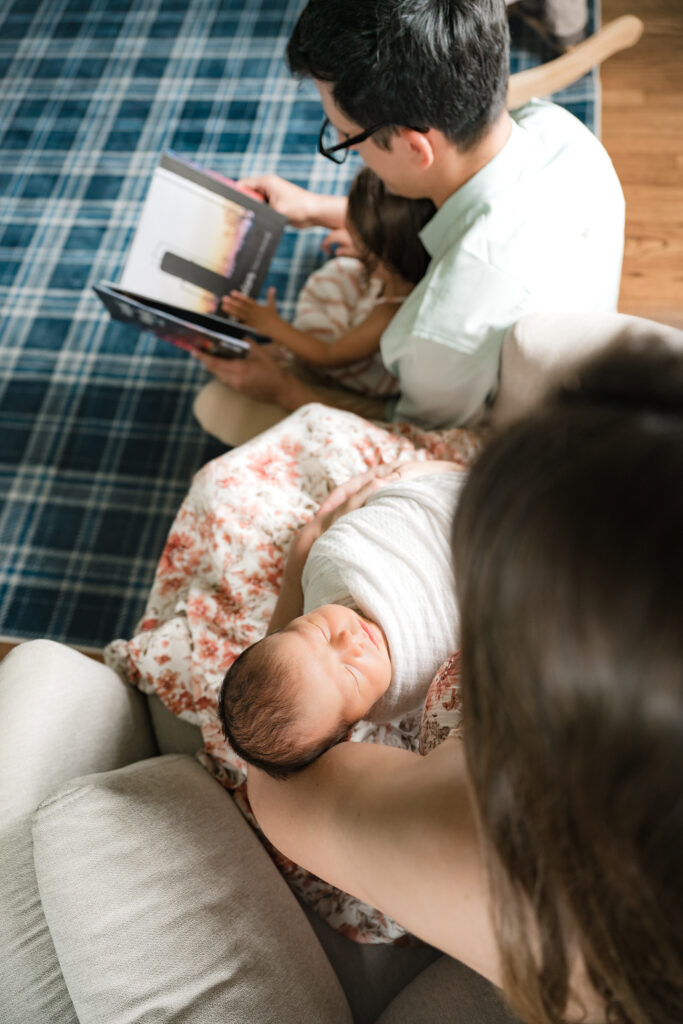 A family is photographed in a series of newborn nursery photos in Houston TX. 
