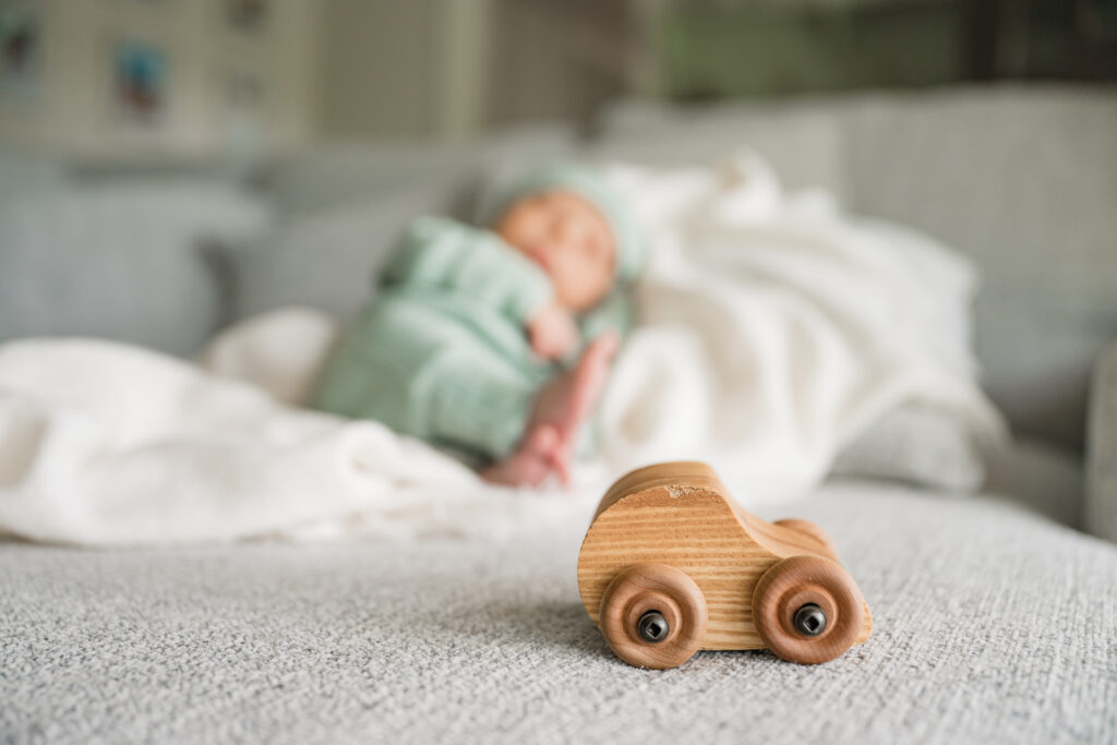 A  newborn is photographed atop a blanket during in home newborn photography in Houston.